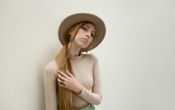 Young,Red,Hair,Girl,In,Hat,,Dressed,In,Beige,Blouse