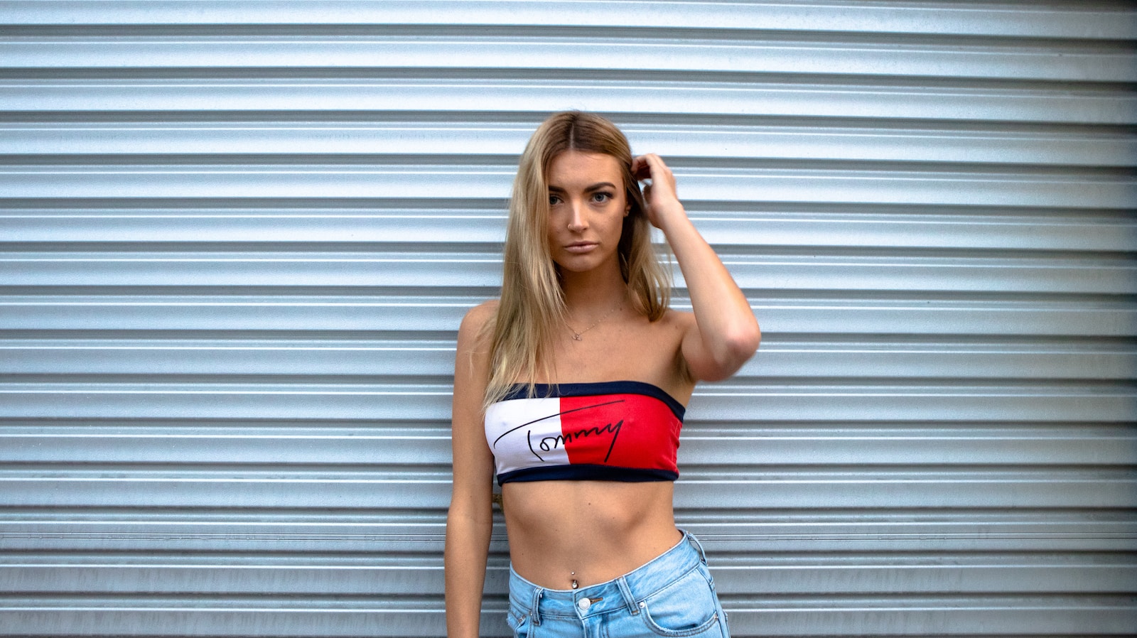 woman standing in front of roll-up door