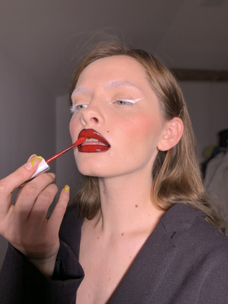 A Woman Putting Lip Tint