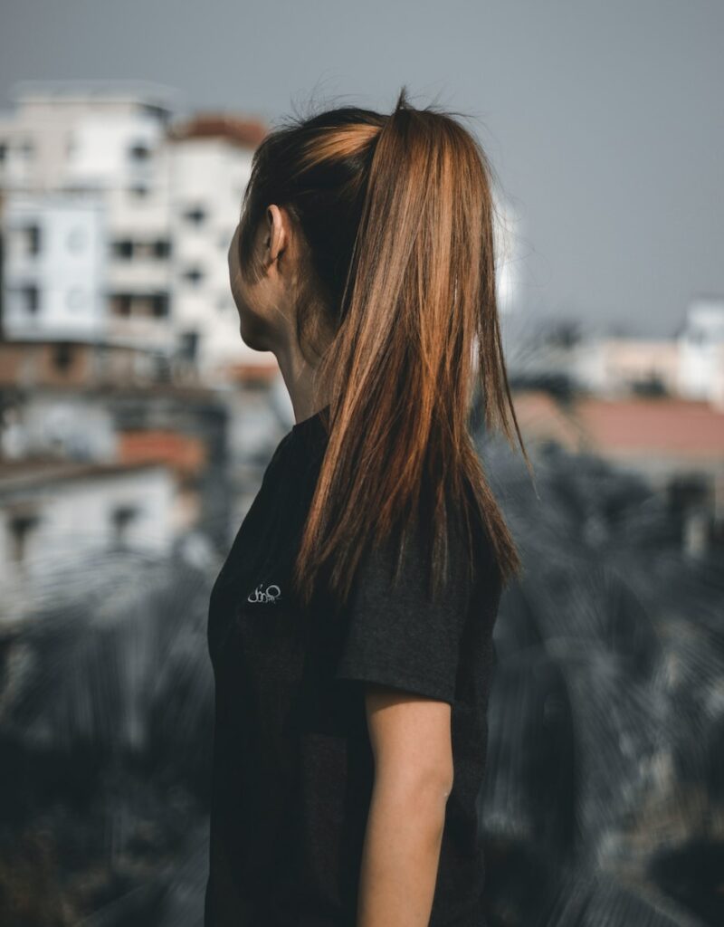 woman looking sideward during daytime