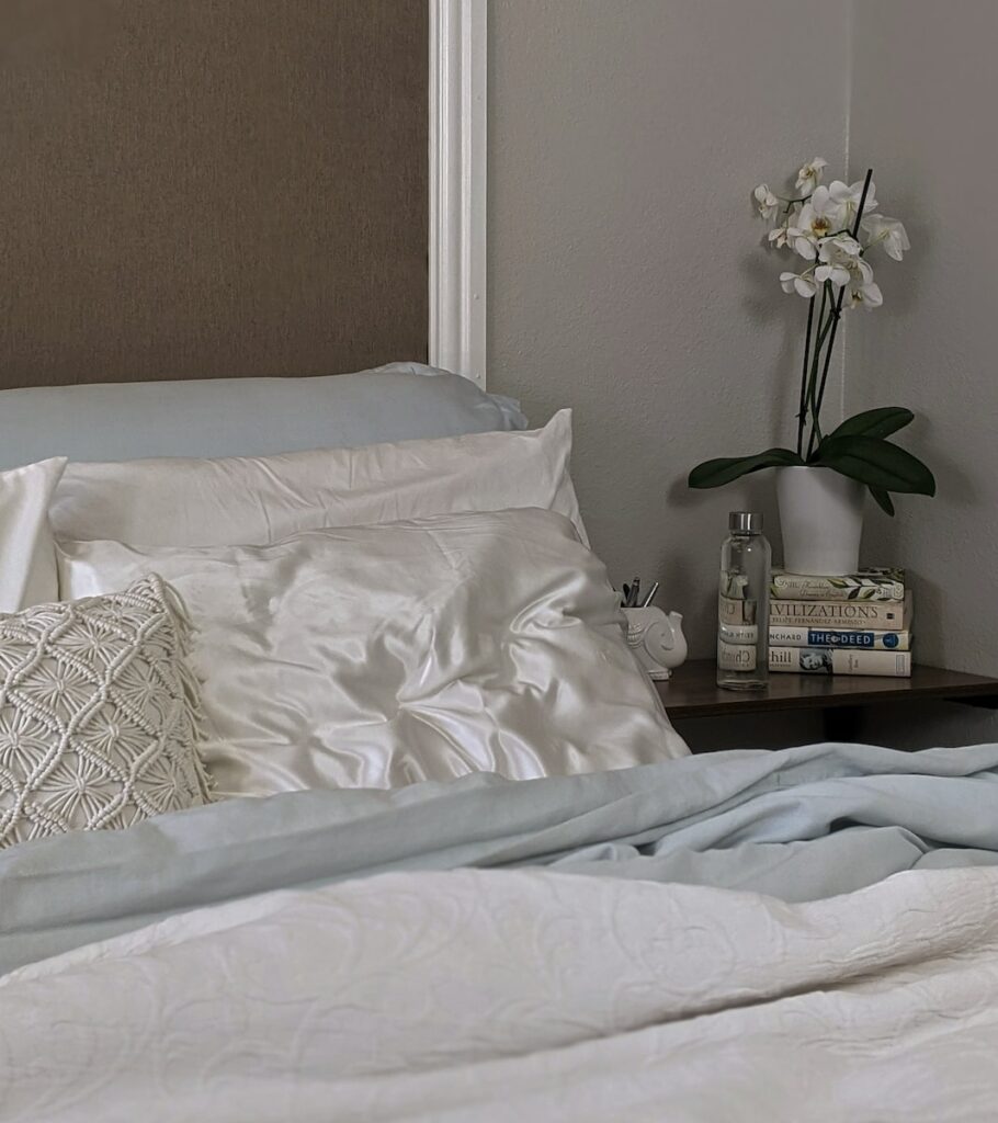 white and gray floral bed linen