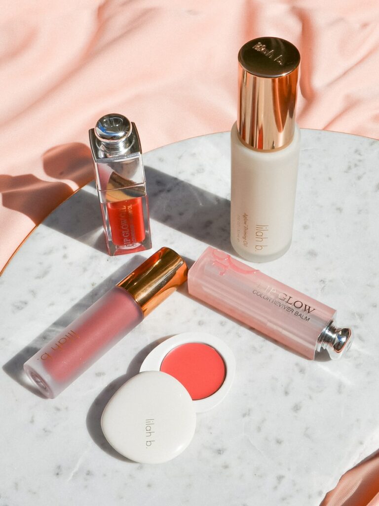 a table topped with three different types of lipstick
