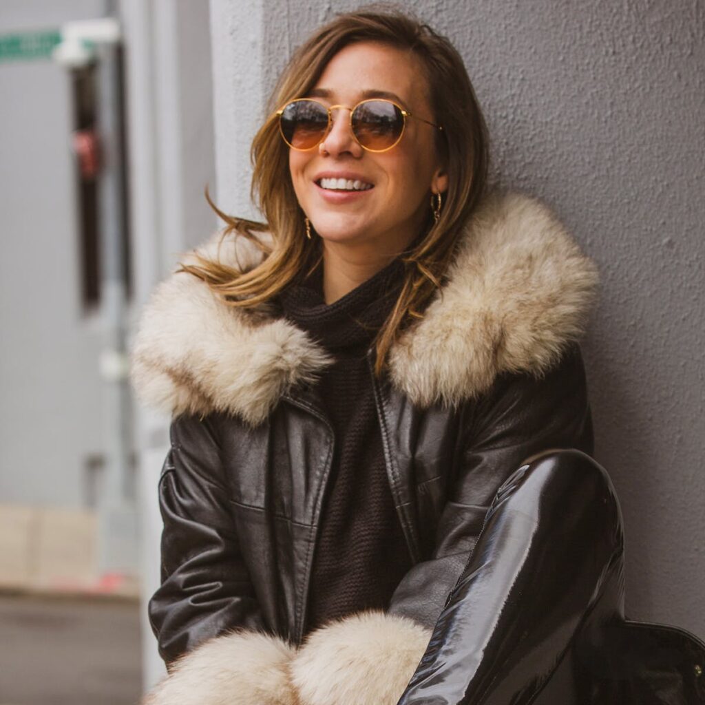 Woman Wearing Black and White Fur Coat and Brown Sunglasses