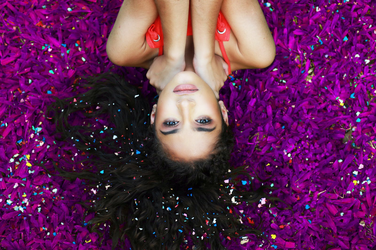 Woman Lying on Purple Surface