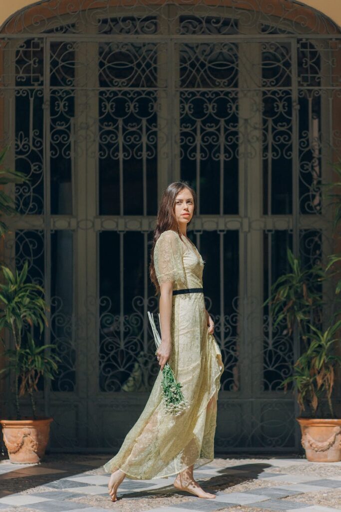 Woman Standing in Front of a Wall Window