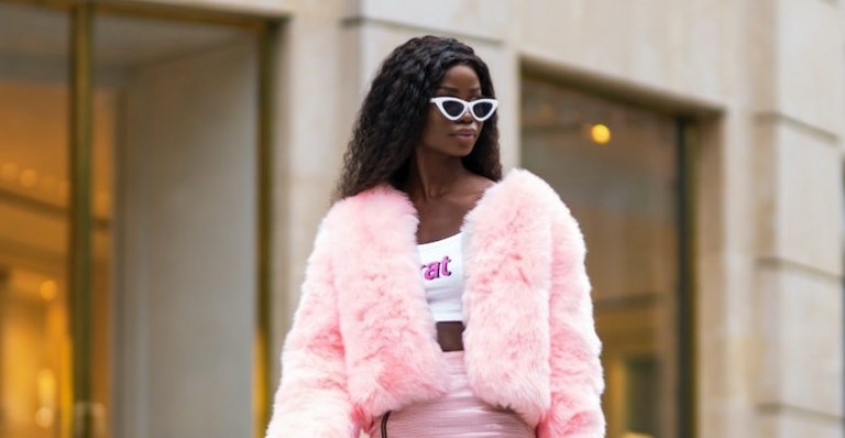 woman in pink fur coat and black sunglasses