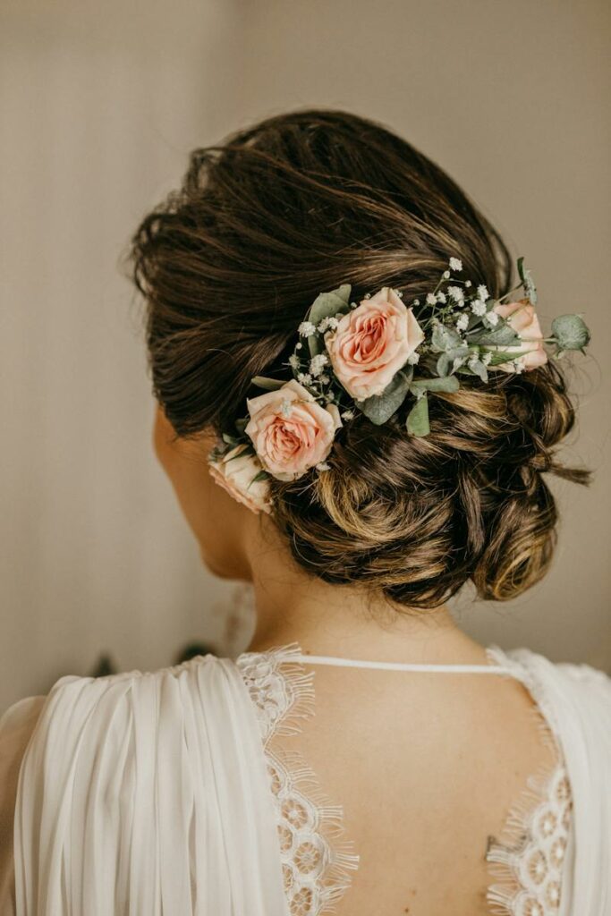 Woman in Wedding Updo with Flowers in Hair