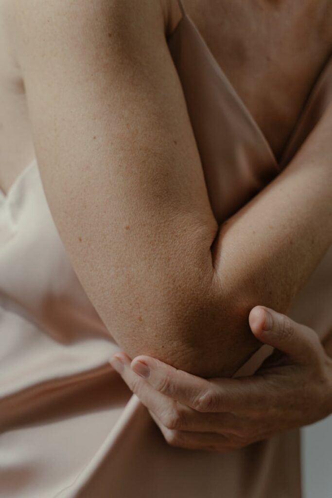 A Woman Touching her Elbow