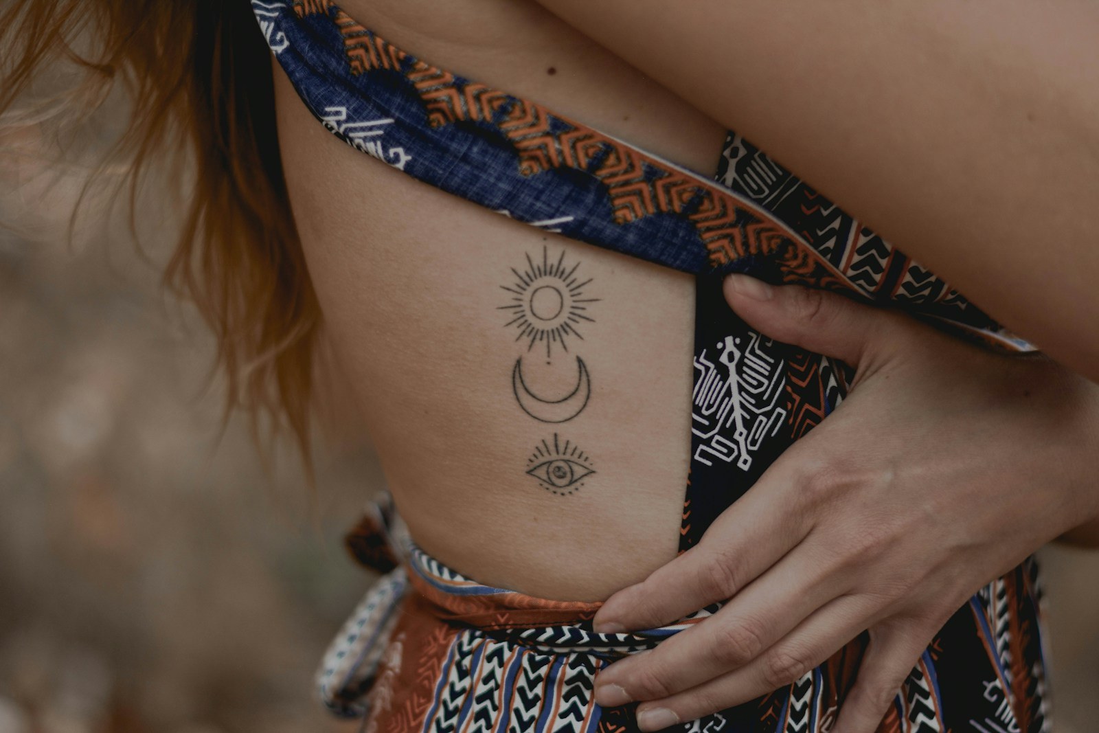 woman with floral tattoo on her right arm