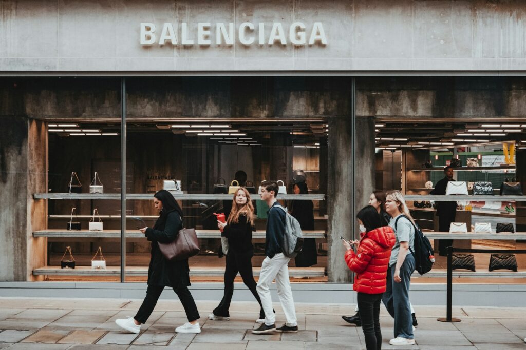 a group of people walking outside a store