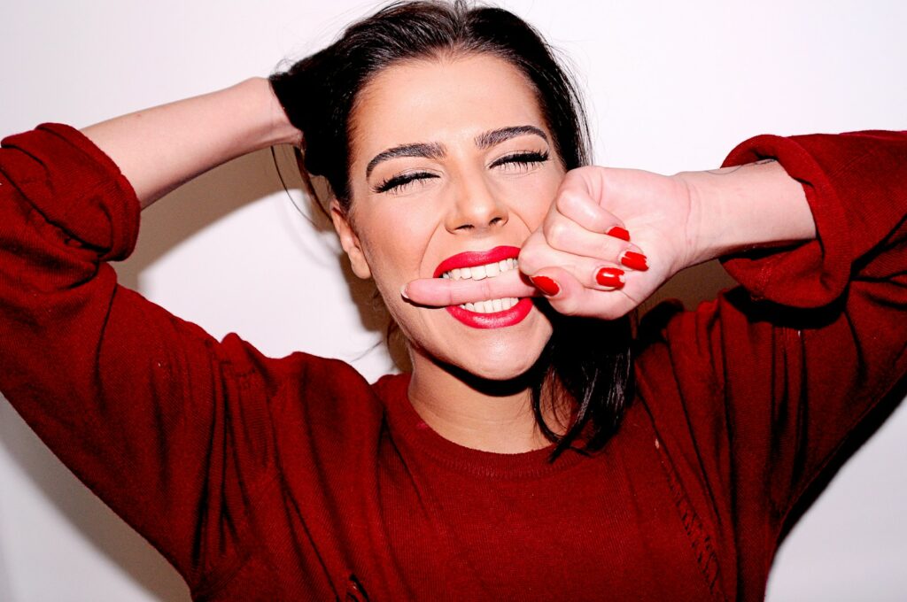 woman in red crew-neck sweater