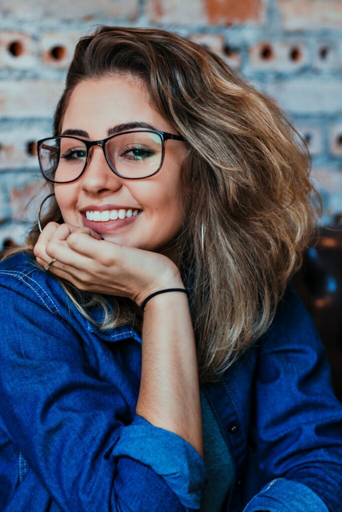 closeup photo of woman wearing black framed eyeglasses