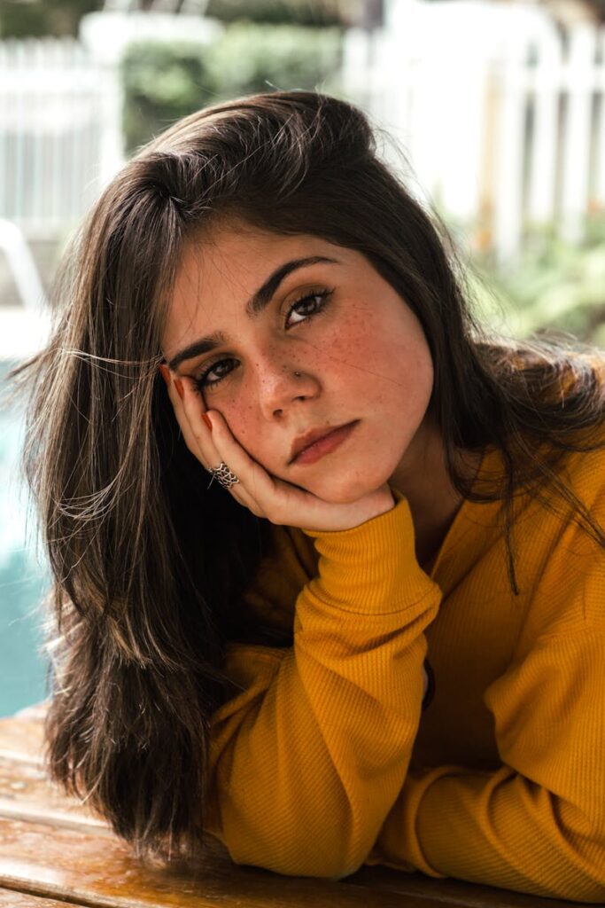 Photo of Woman Wearing Yellow Sweater