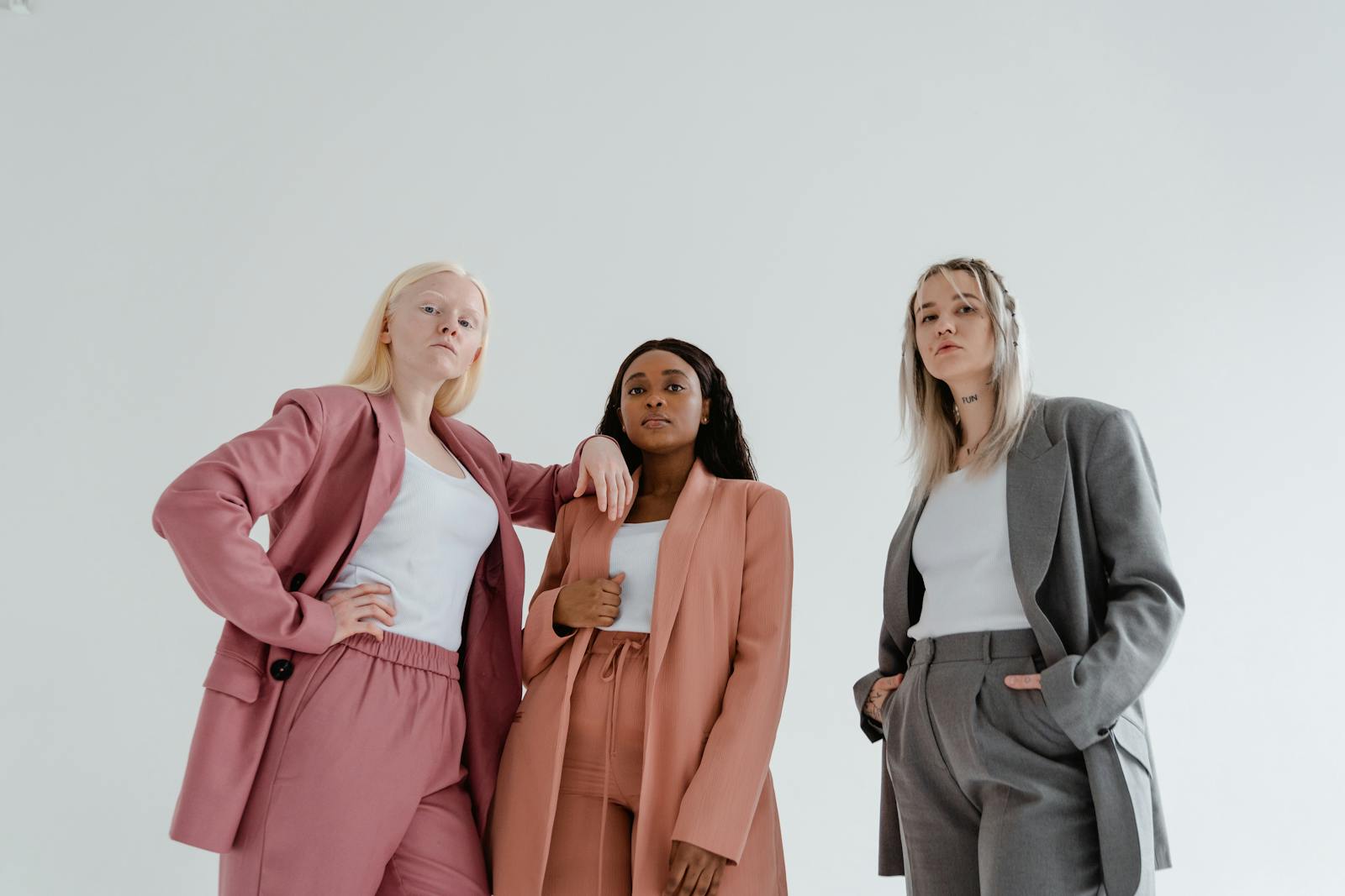 A Low Angle Shot of Women Wearing Blazers in Different Colors