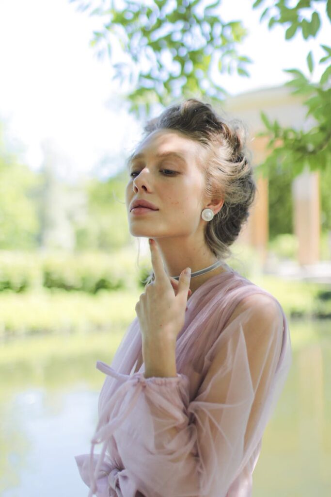 A Woman Wearing Pearl Earrings